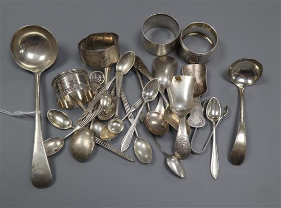A small group of silver/white metal comprising four spoons, two ladles, four serviette rings, Dutch spoons and a plated napkin ring